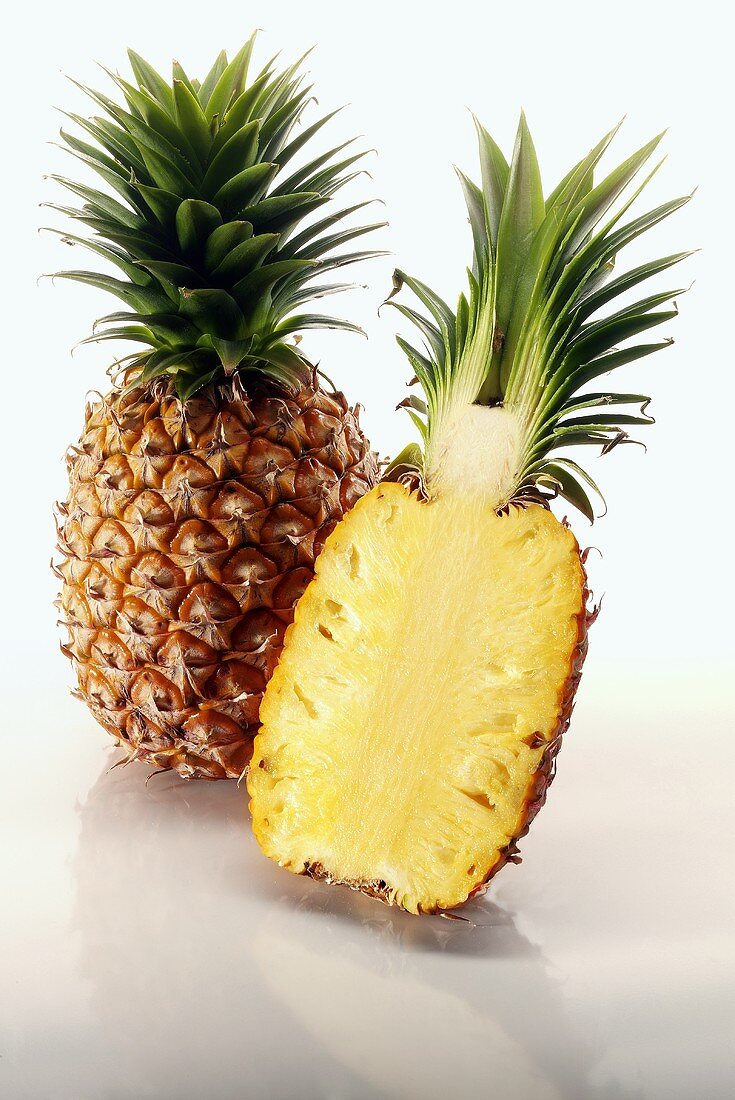 One whole pineapple and half a pineapple