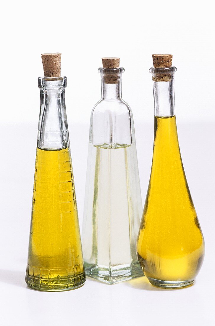 Three different oils in bottles