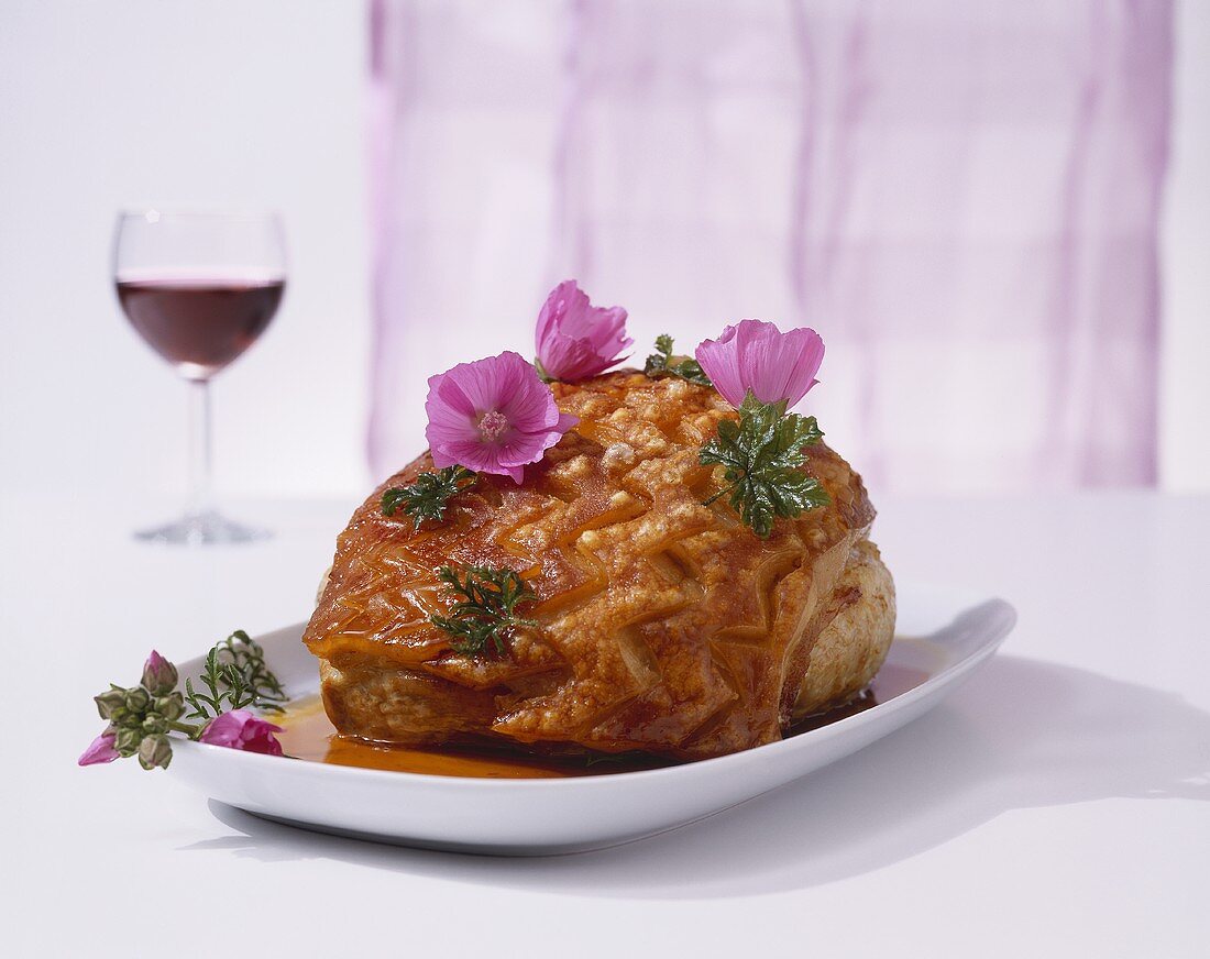 Roast pork with crackling and edible flowers