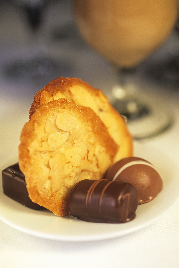 Almond biscuits and assorted chocolates on plate