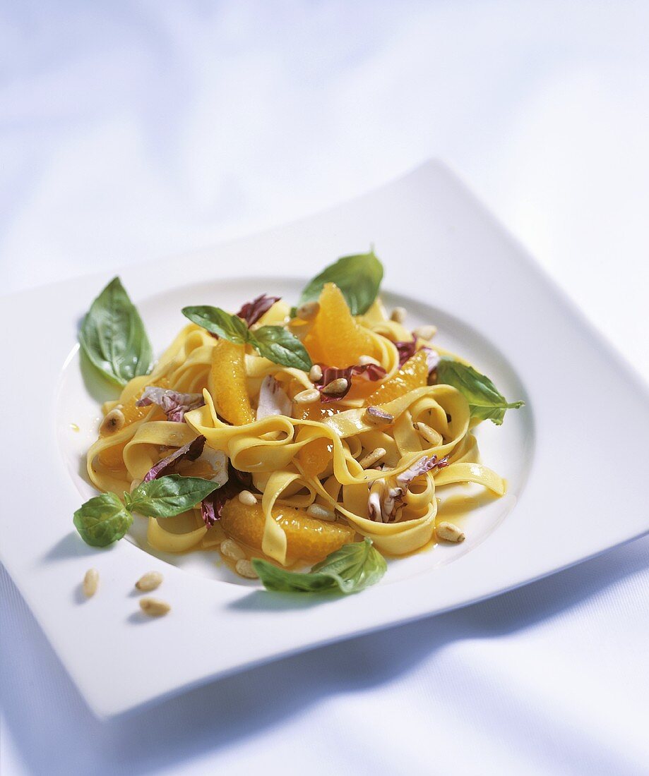 Tagliatelle salad with oranges, radicchio and pine nuts