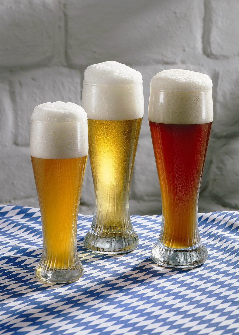 Wheat beer in glasses: Hefeweizen (unfiltered), Kristall (filtered) & dark