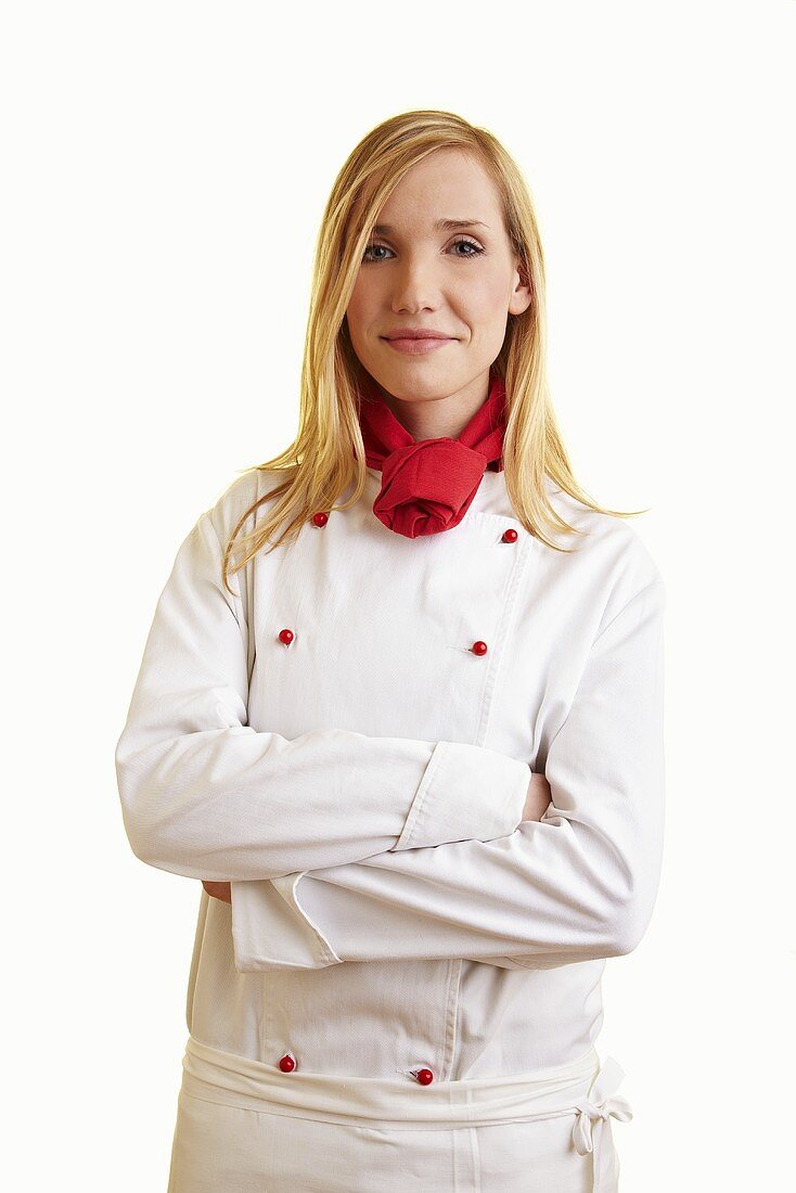 Blond female chef in work clothes