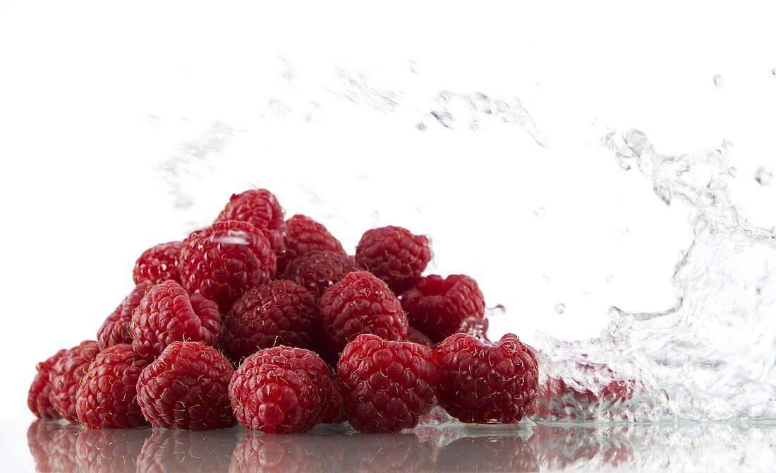 Raspberries with splashing water