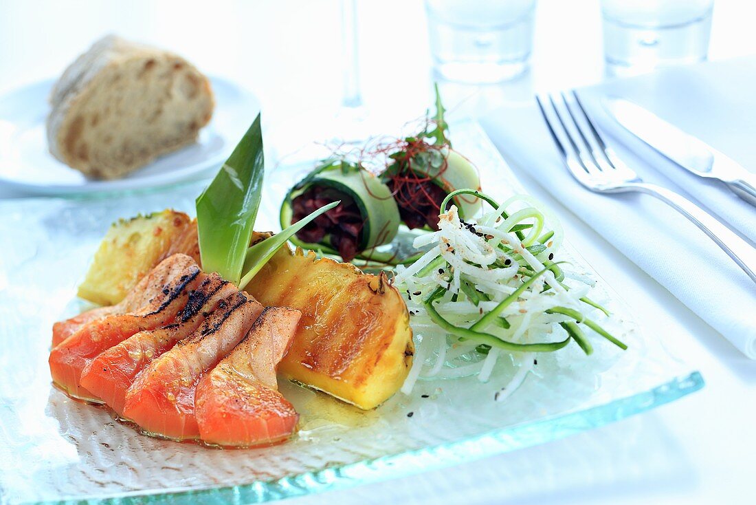 Salmon with teriyaki sauce, pineapple and julienne vegetables