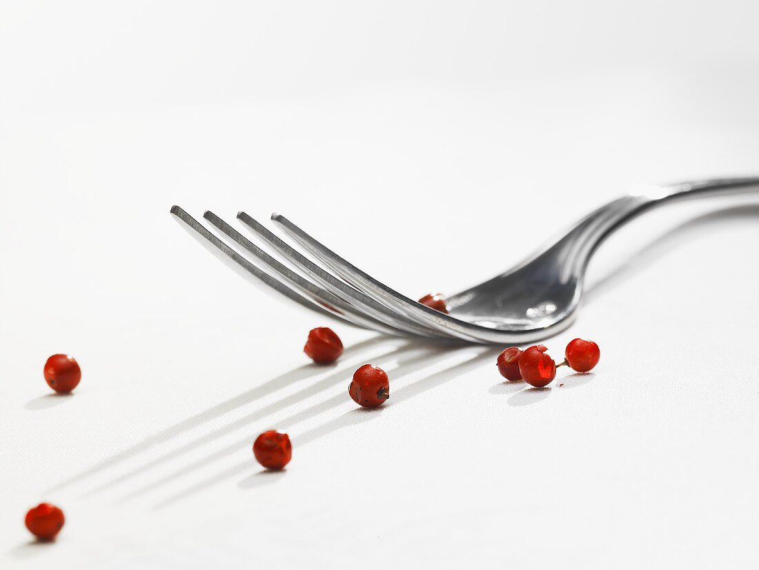 Pink peppercorns and a fork