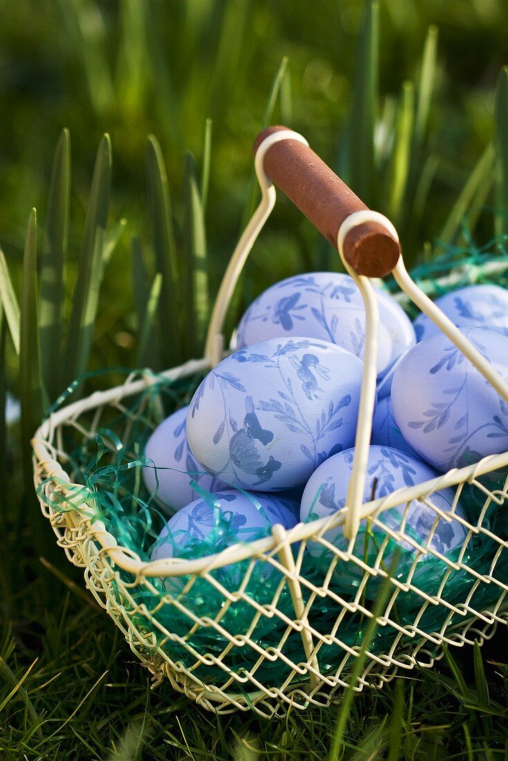 Blue Easter eggs in wire basket