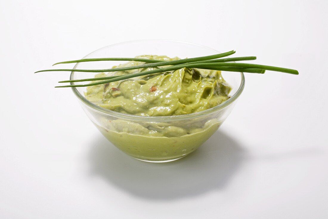 Guacamole in a dish with chives