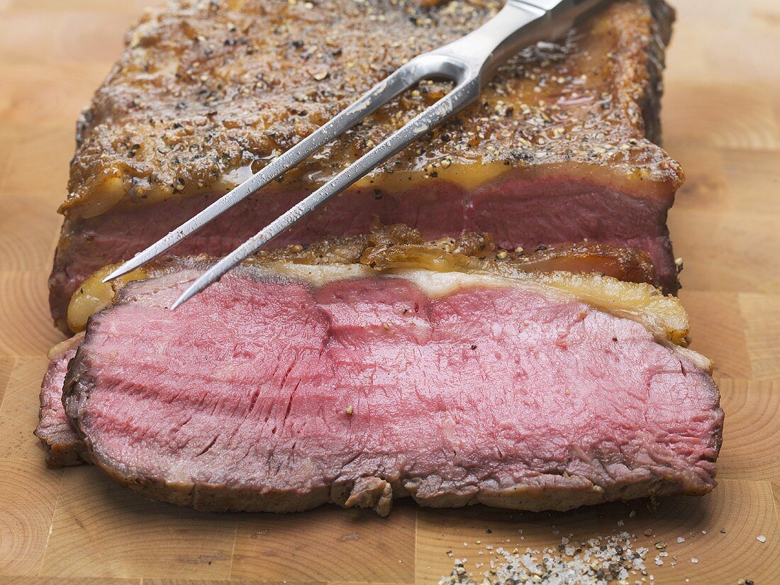 Roast beef with meat fork