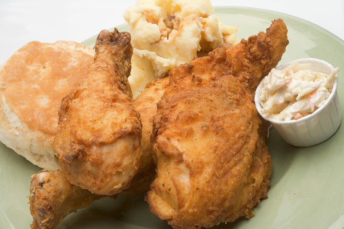 Chicken with mashed potato, biscuit (scone) and coleslaw