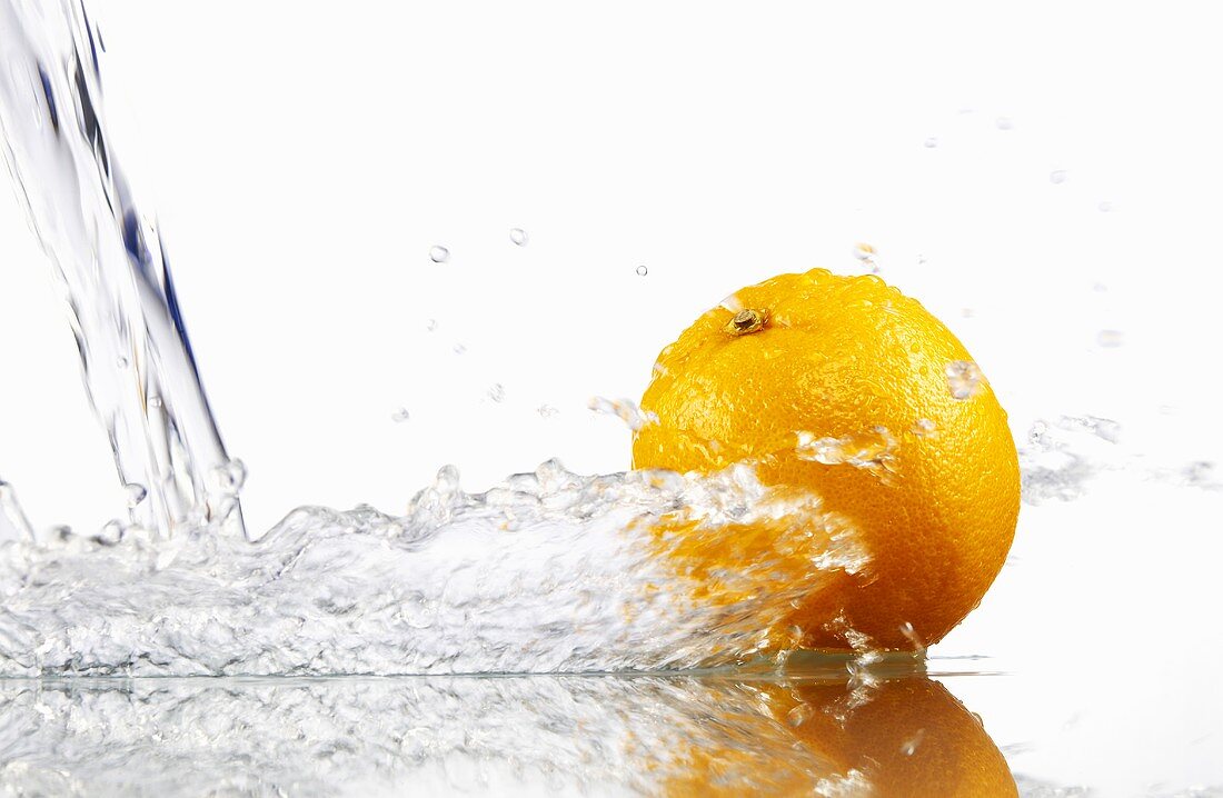 Orange with splashing water