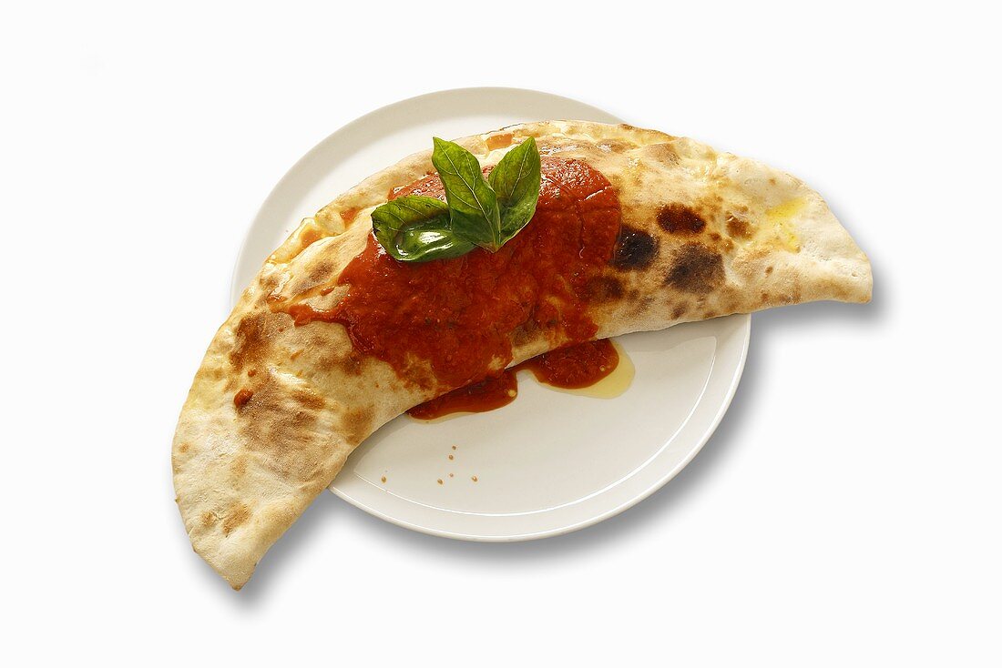 Calzone with tomato sauce and basil