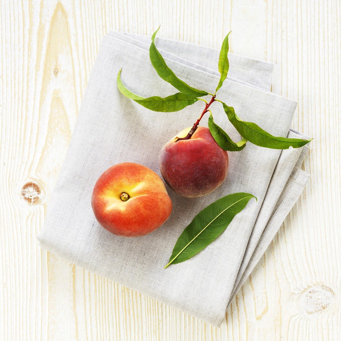 Organic peaches on linen cloth