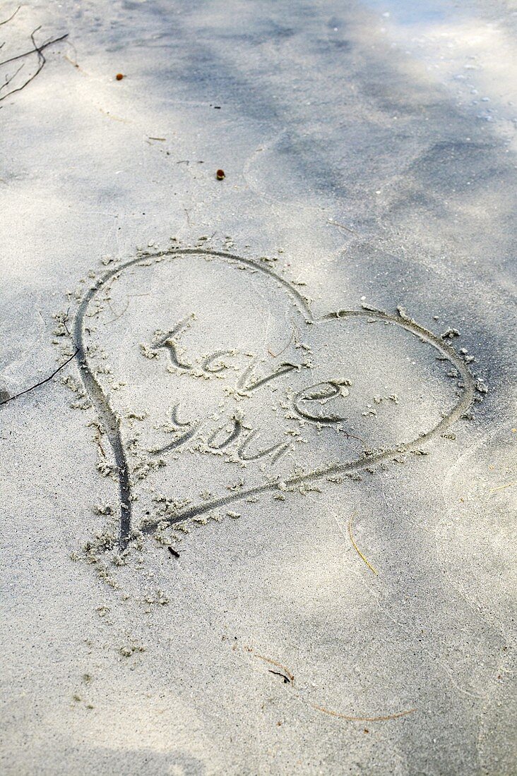 Heart drawn in sand