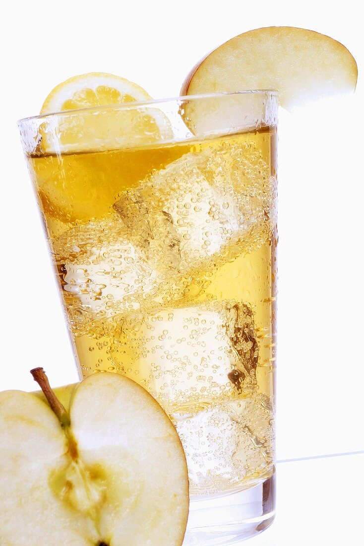 Apple spritzer with ice cubes in glass