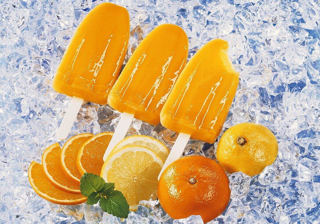 Three mandarin orange and lemon ice lollies