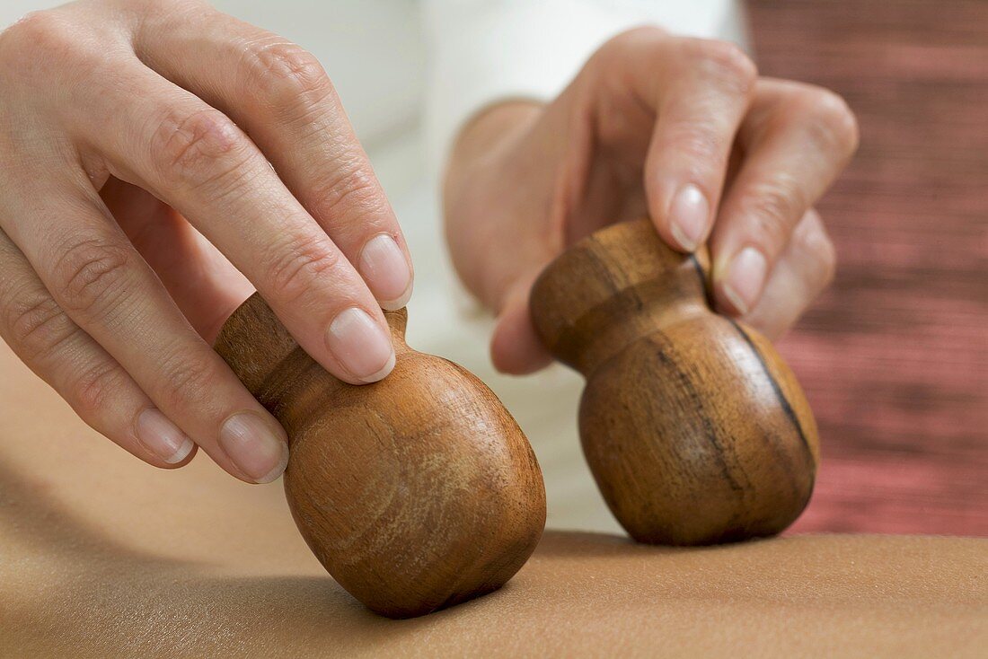 Massaging with wooden massagers