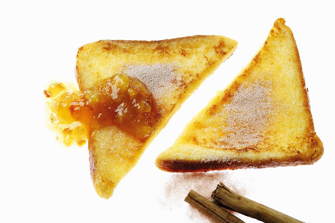 Two slices of french toast with cinnamon sugar and jam