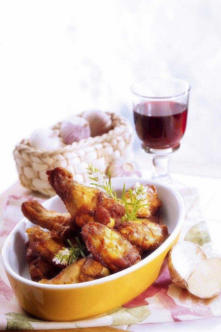 Chicken legs with glass of red wine