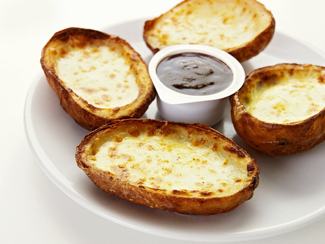 Baked potatoes with cheese and dip