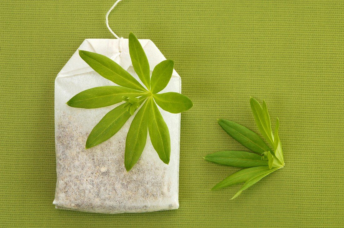 Tea bag and woodruff leaf
