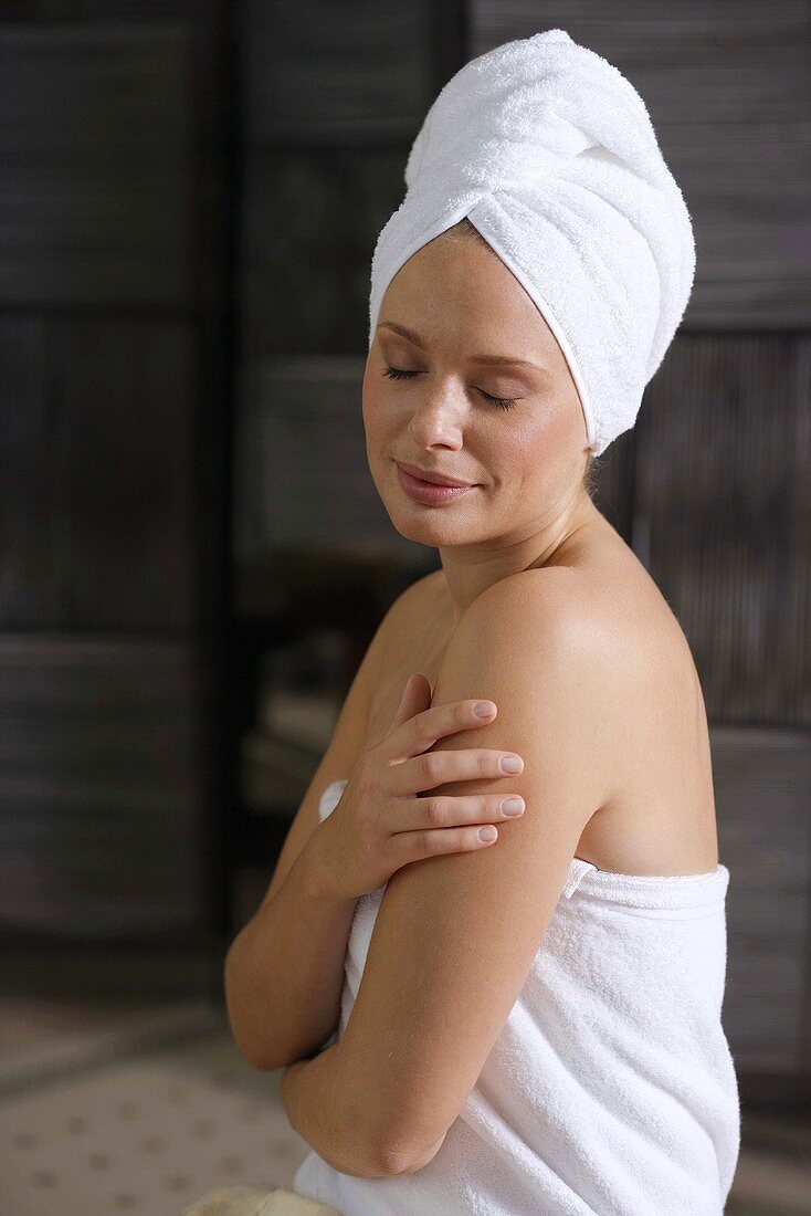 Germany, woman wearing towel turban