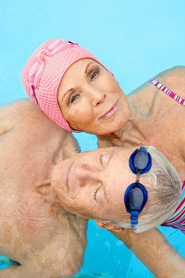 Germany, Senior couple in swimming pool