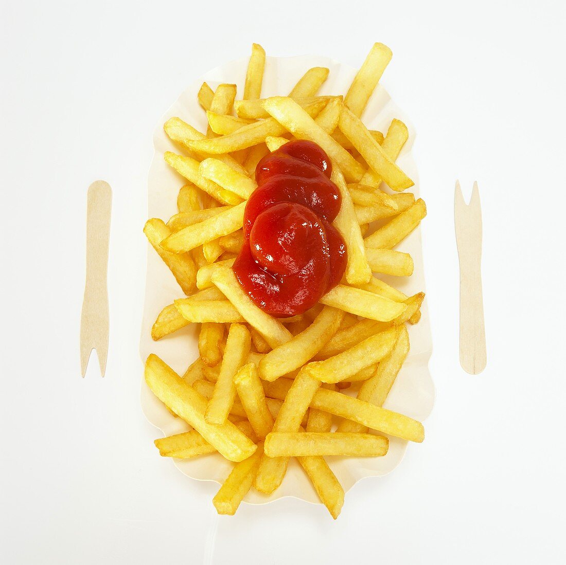 Ketchup on French fries, close-up, elevated view