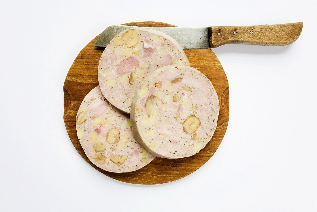 Stuffed pig's stomach from the Palatinate on wooden board