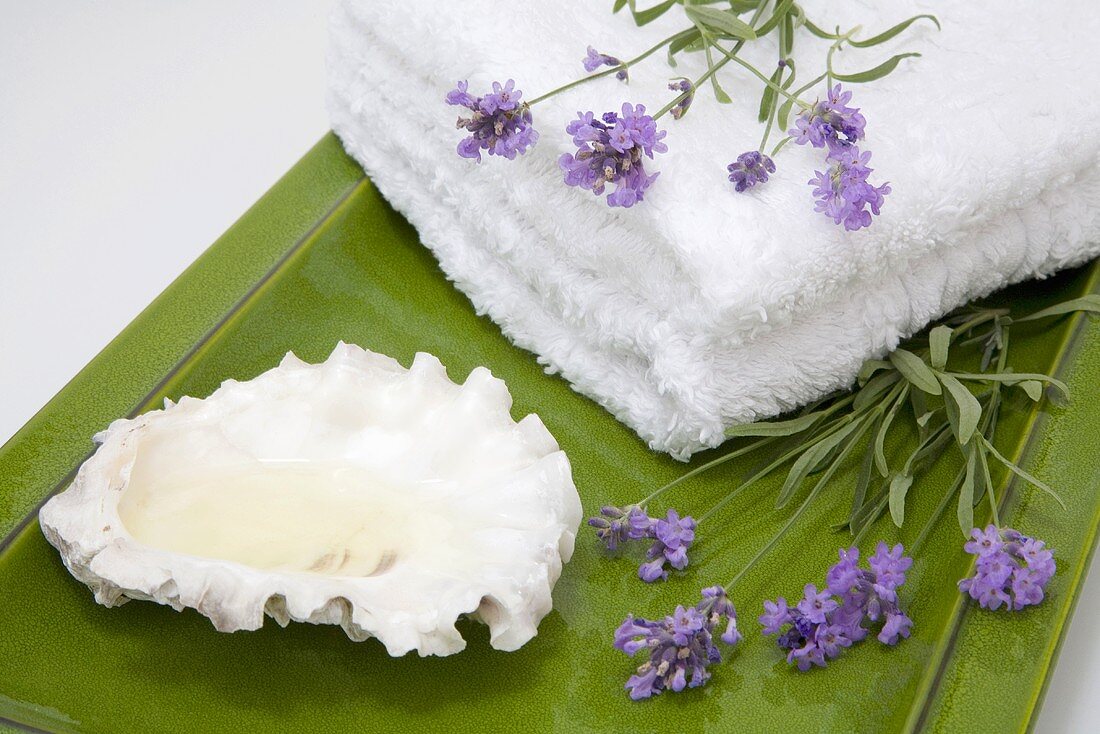 Lavender, towels and shell on tray, close-up