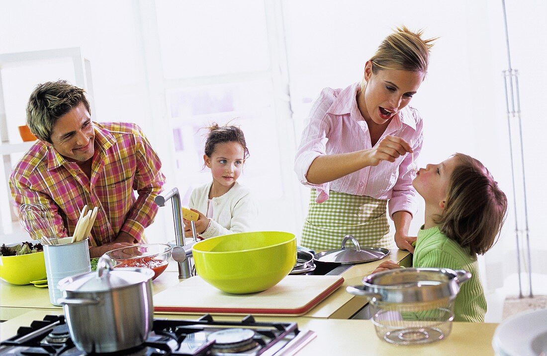 Parents with children (4-7) in kitchen