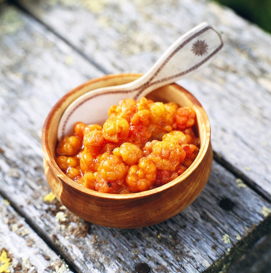 Cloudberries in a small bowl with reindoor antler spoon