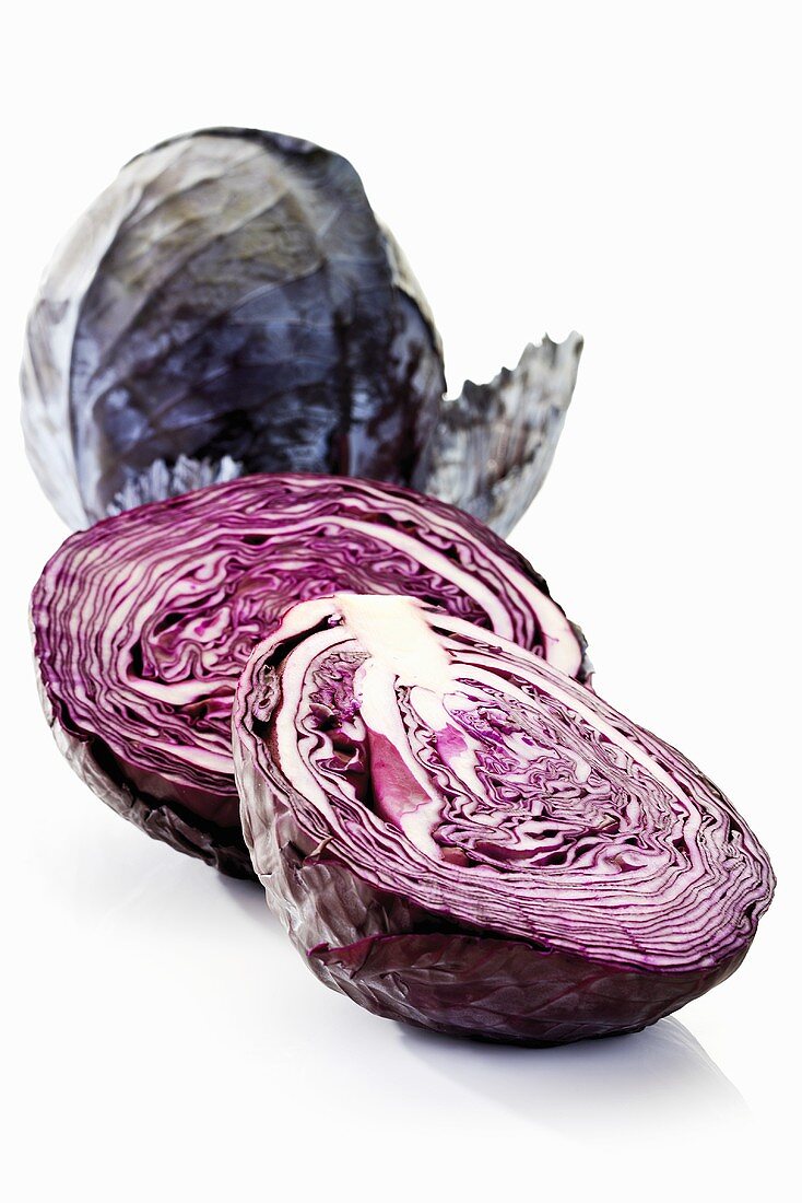 Whole and halved red cabbage