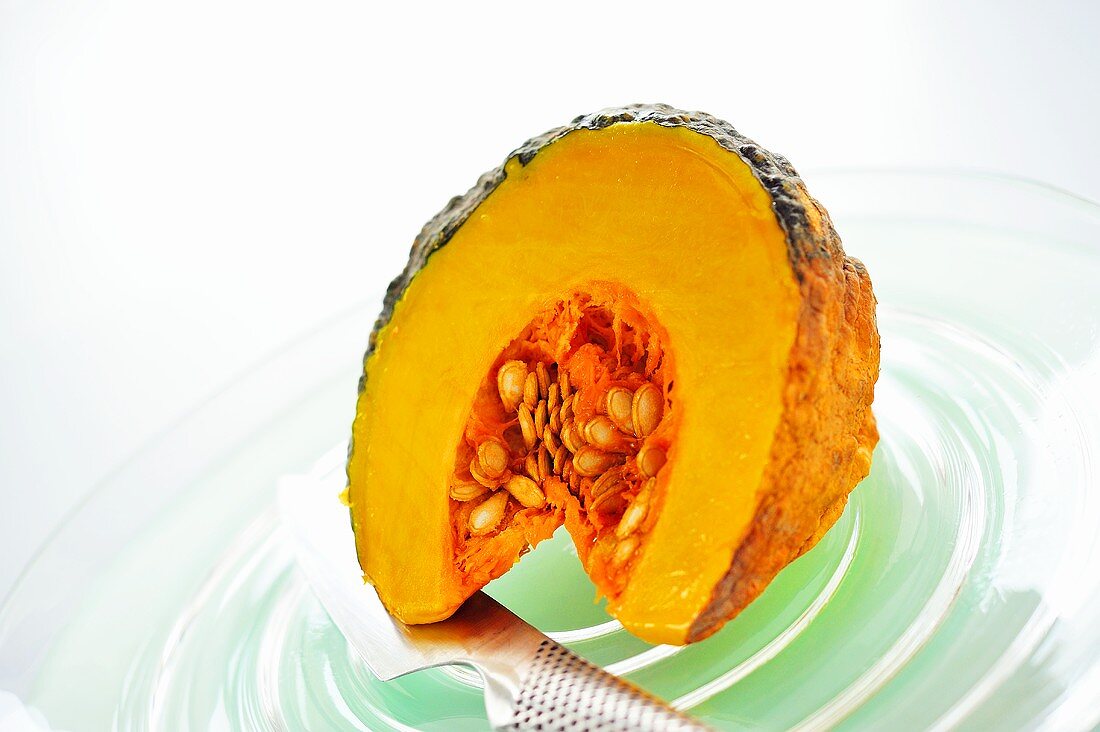 A slice of pumpkin with seeds