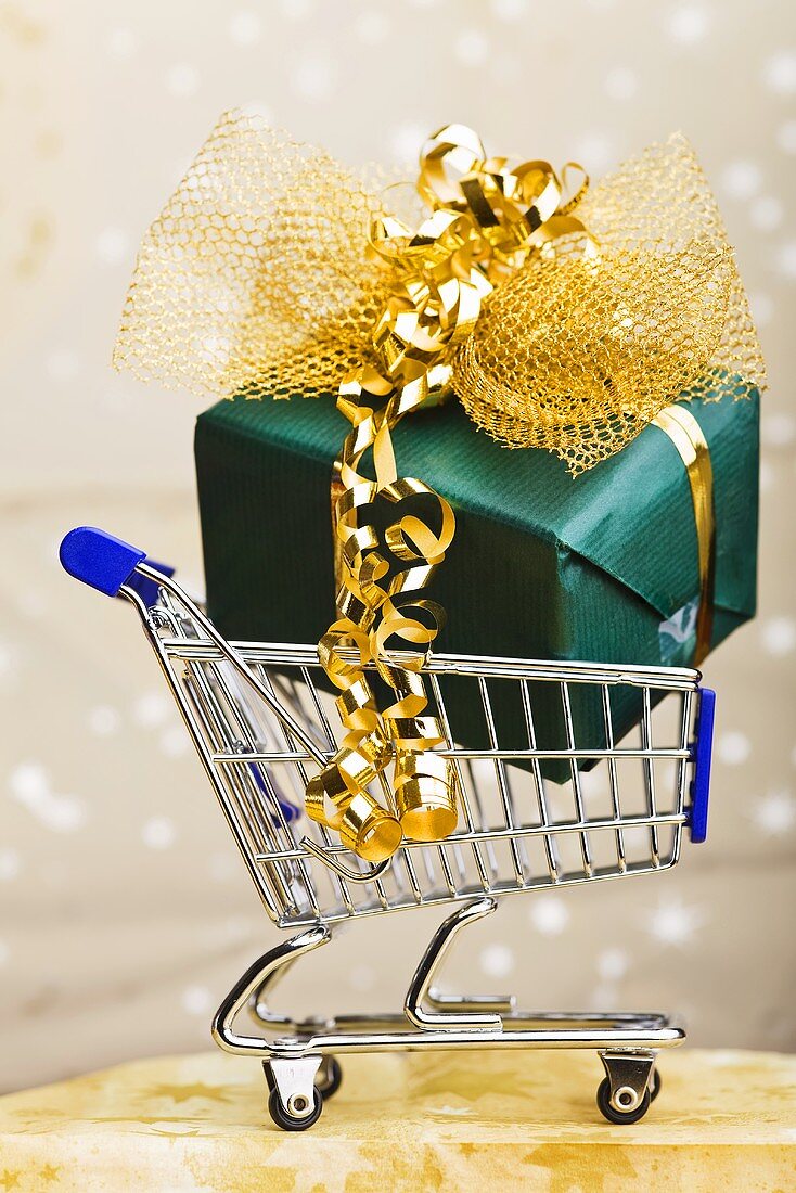 Christmas gift in shopping trolley