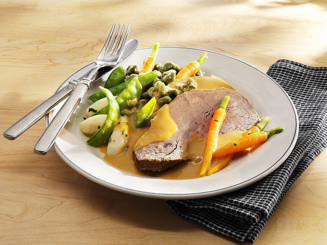 Roast veal with vegetables and cream sauce