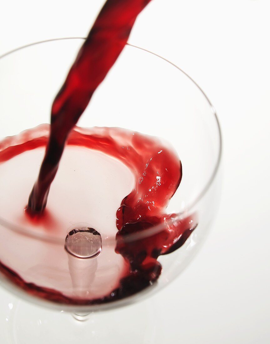 Pouring red wine