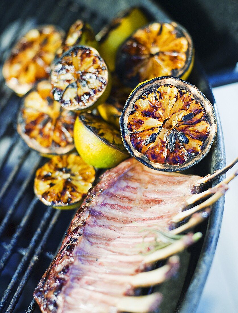 Grilled lemon halves and ribs of mutton