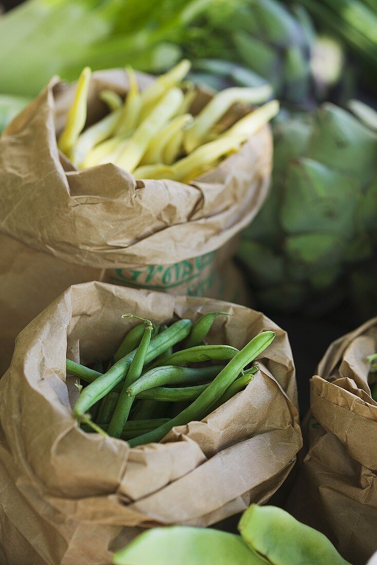Various types of beans in paper bags