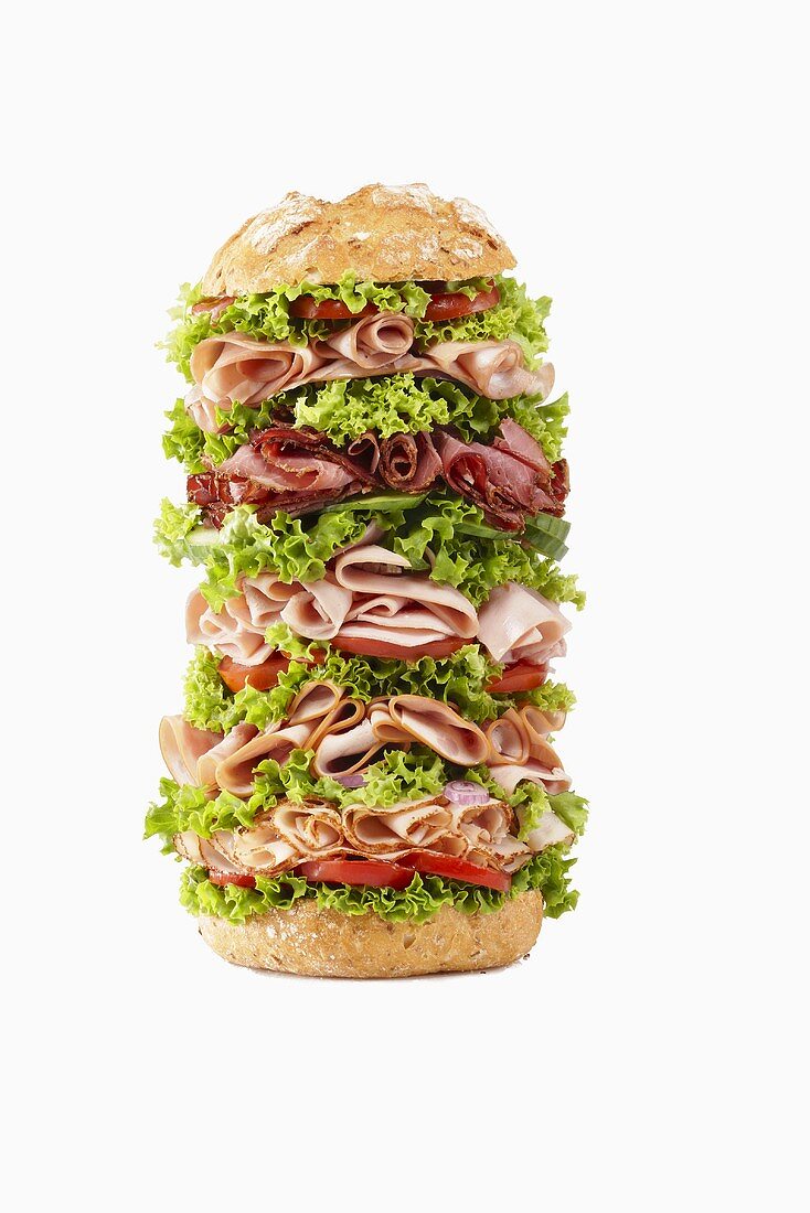 Giant ham, sliced sausage and lettuce sandwich