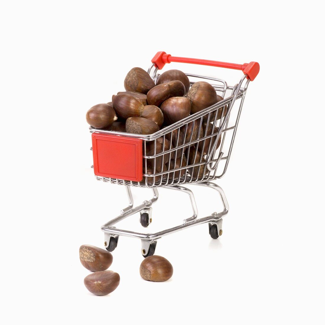 Toy shopping trolley full of chestnuts