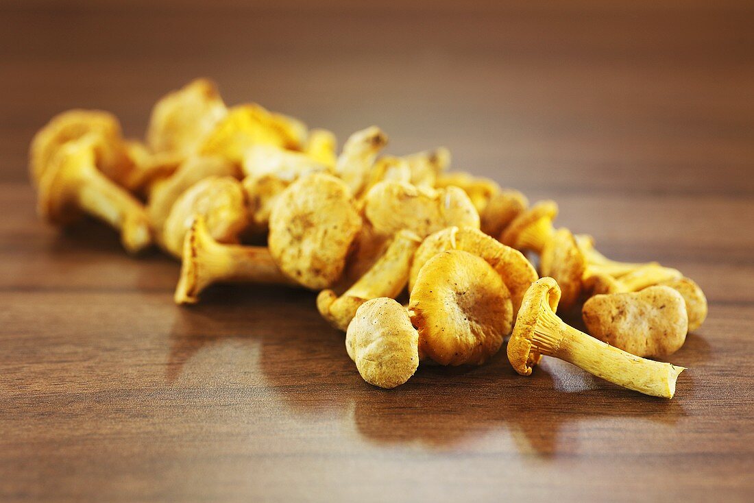 Chanterelles on wooden table