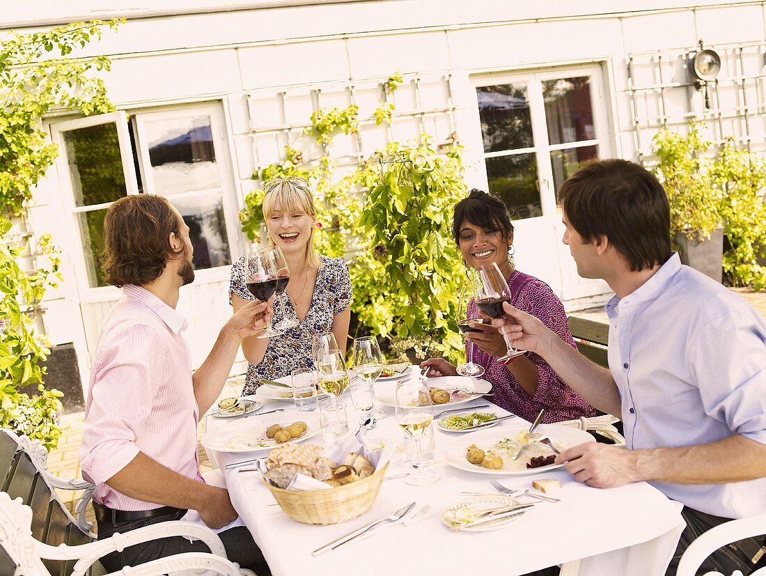 Two couples having a meal together