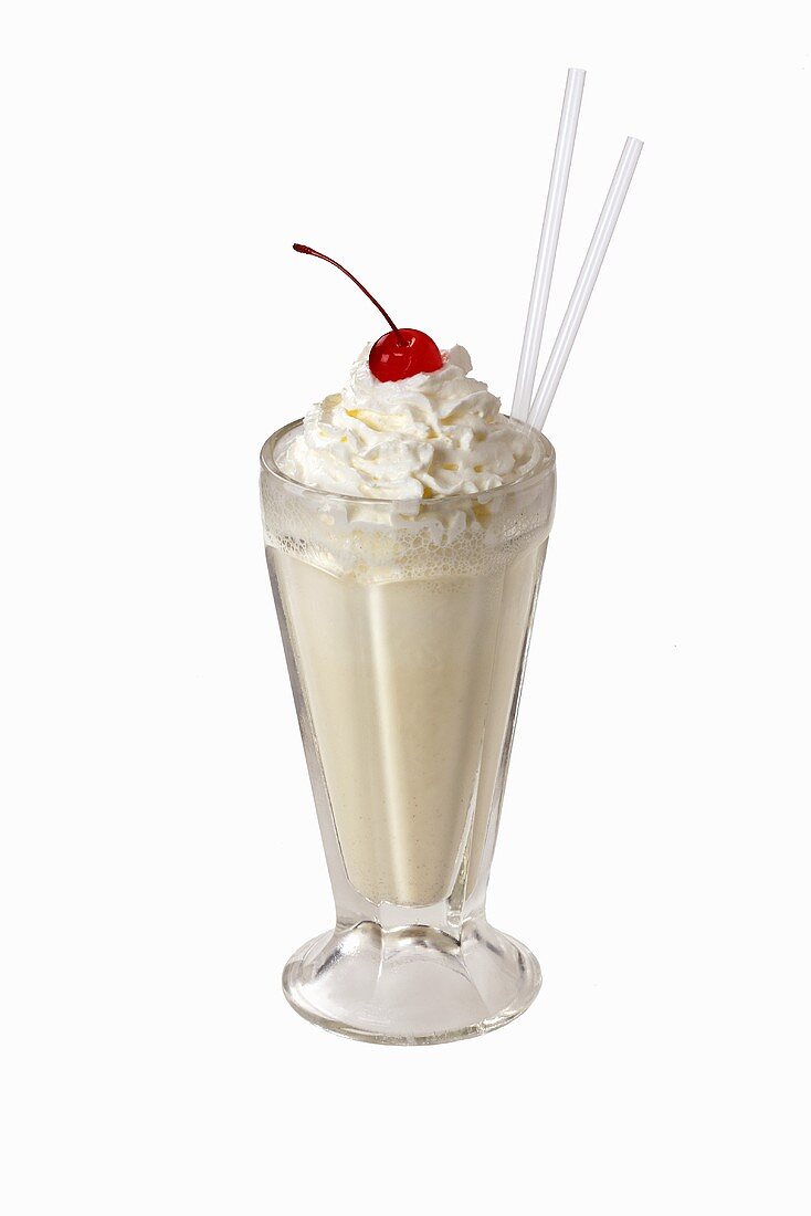 Vanilla milkshake with cream and cherry