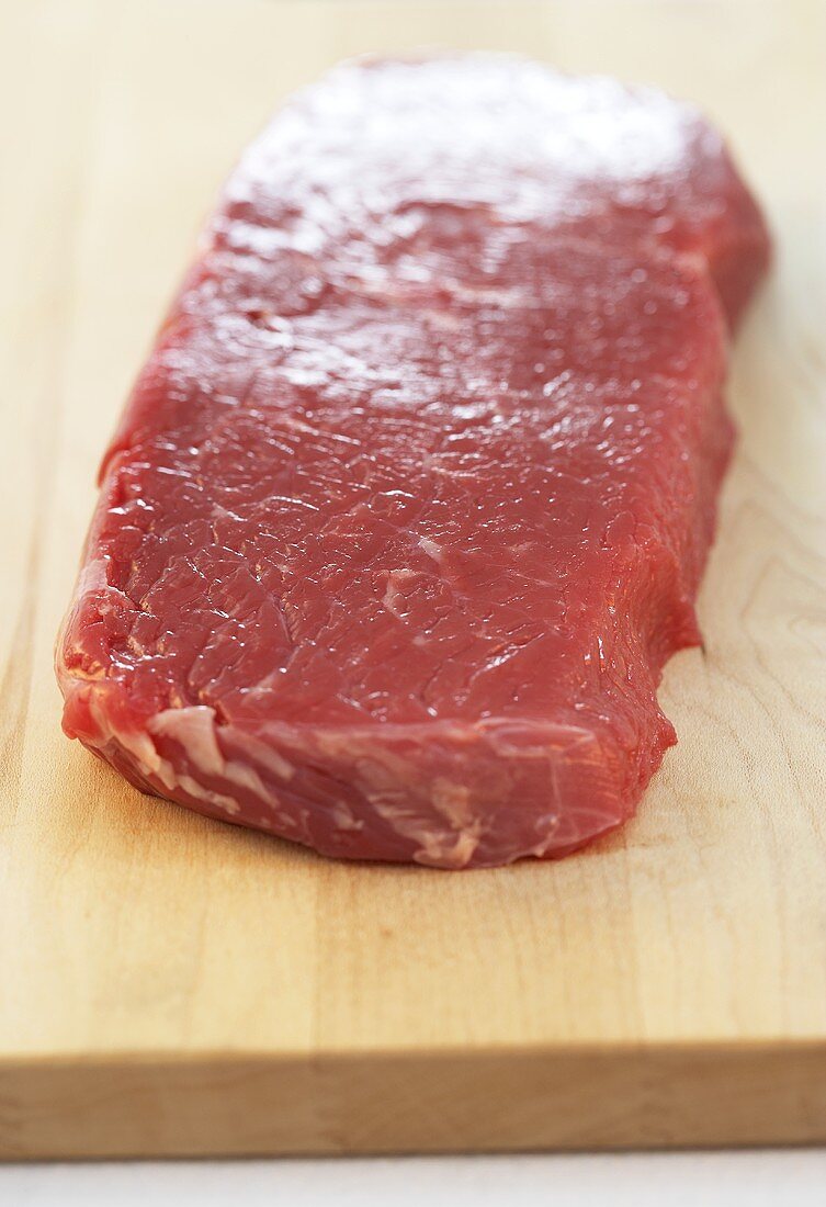 Fresh beef on chopping board