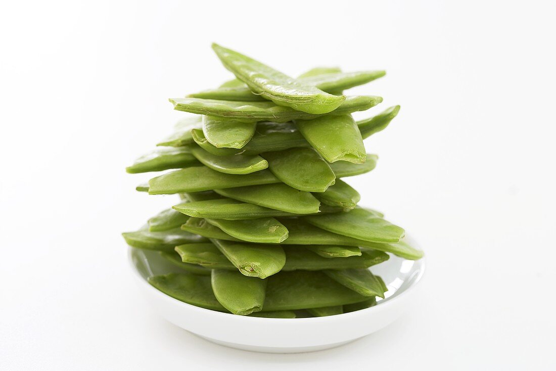 Mangetout (stacked) on plate
