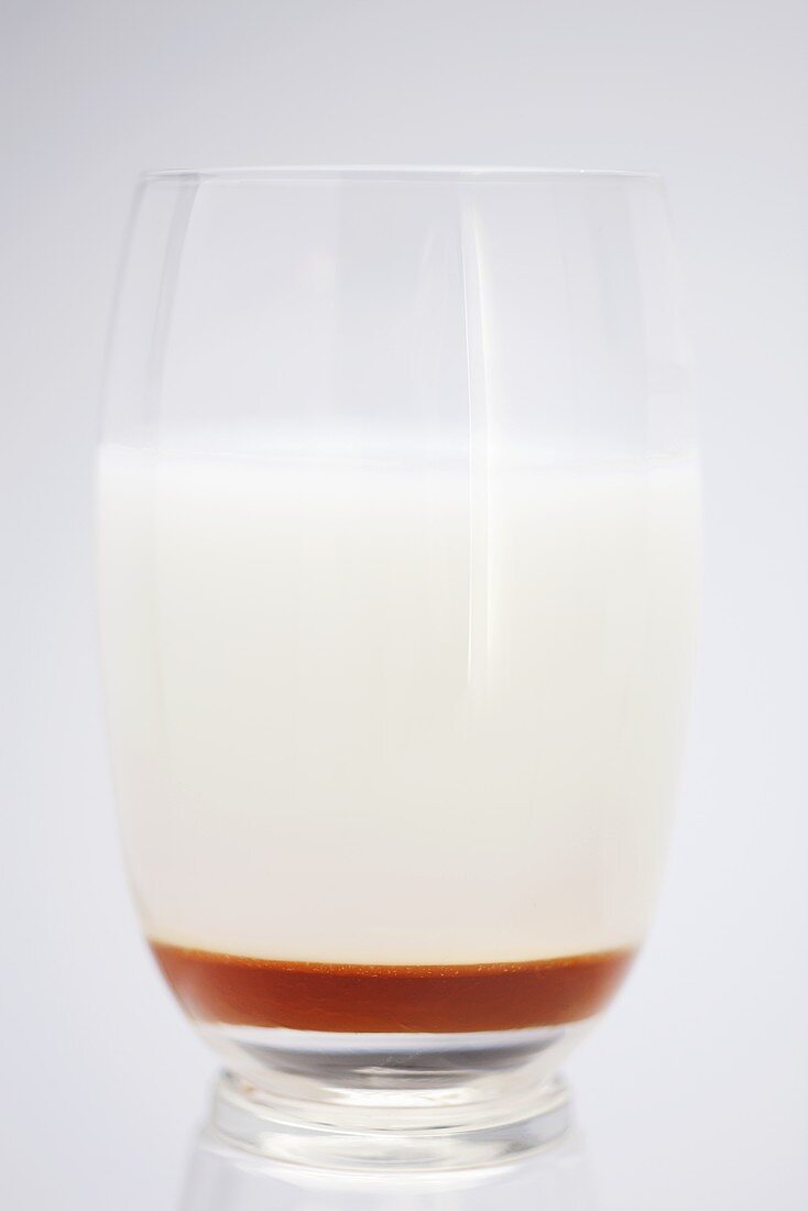 A glass of whey with honey