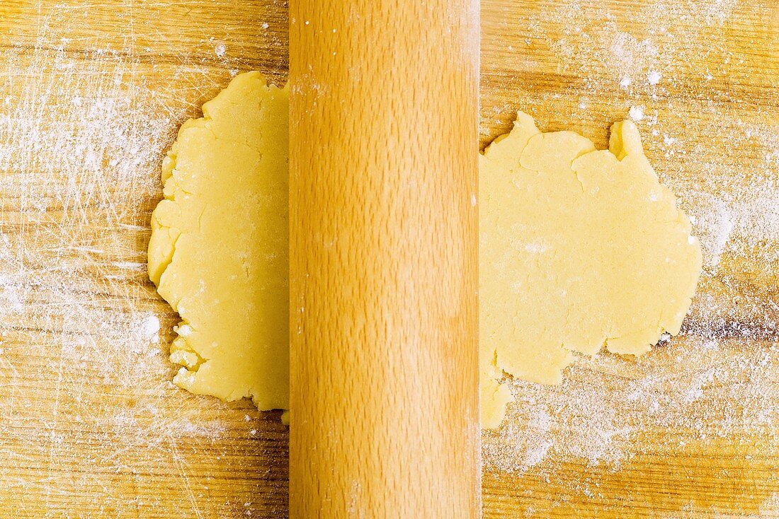 Rolling out biscuit dough with rolling pin
