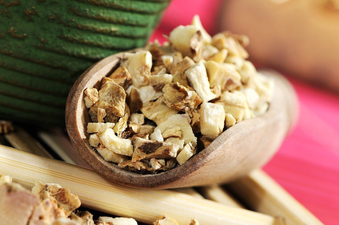 Dried anemarrhena root in wooden scoop