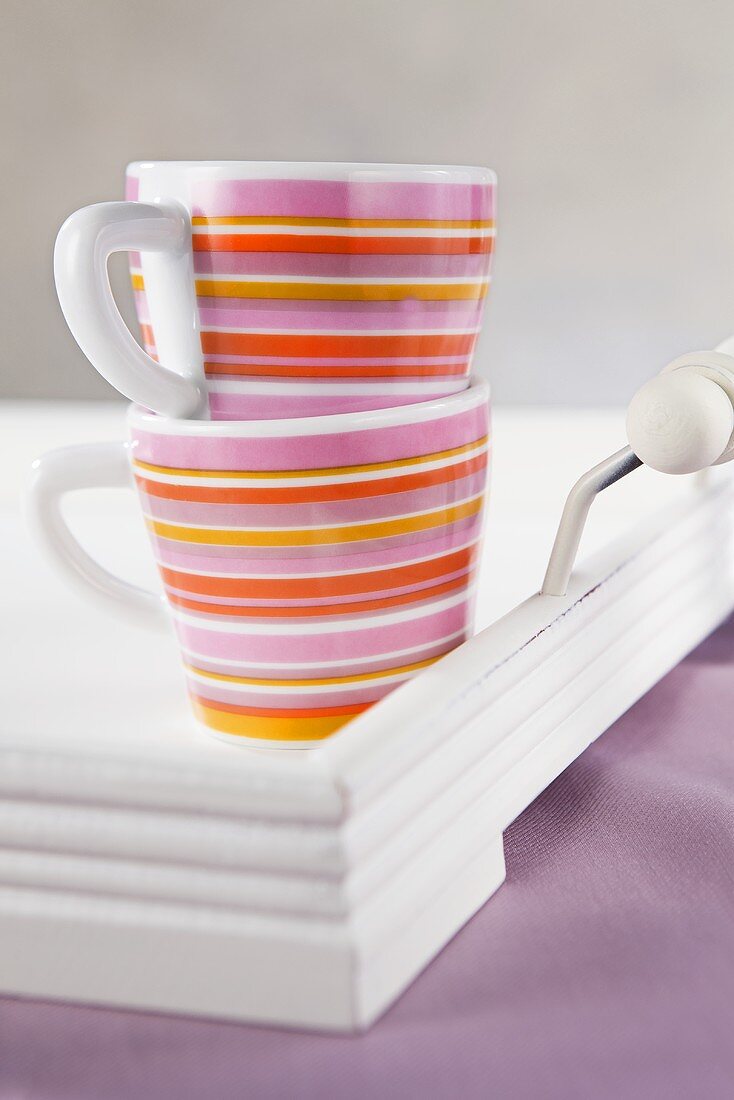 Striped mugs on tray